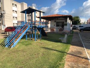 a playground in front of a building at Ap Turquesa in Teresina