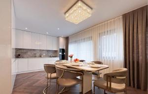 a dining room with a table and some chairs at Lovely Apartment In Rovinj in Rovinj