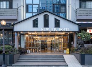 a new eu hotel on a city street at New Jeju Hotel in Jeju