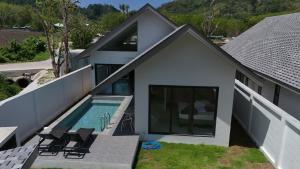 an aerial view of a house with a swimming pool at Akara Poolvilla Naithon Beach in Ban Sakhu