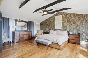 a bedroom with a bed and a ceiling fan at Summit Sanctuary with EV Ready Mountain Views in Poughkeepsie