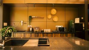 a kitchen with a counter and a counter top at Vanantara Riverside Eco Retreat in Cochin