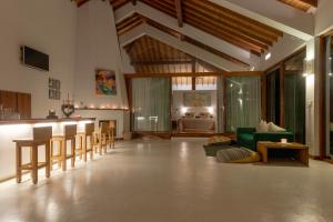 a living room with a green couch and a table at The Glasshouse Victoria in Digana