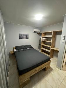 a bedroom with a bed in a room at Grey-B Appartment in Dorp Sint Michiel
