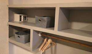 a shelf with two boxes and a microwave on it at Casa Agena in Cartagena de Indias +80 photos