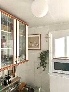a kitchen with a sink and a microwave at Gold Stream House in Seoul