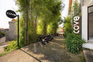 a row of motorcycles parked in front of a building at Cove Wong Village in Tumbak Bayuh