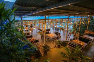 an overhead view of a restaurant with tables and plants at Lamatar Hills Resort in Pātan