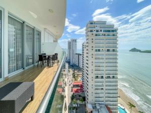 an apartment balcony with a view of the ocean at Luxe Oceanfront Condo in Golden Zone in Mazatlán +68 photos