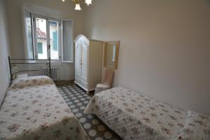 Łóżko lub łóżka w pokoju w obiekcie Colonna Terrace Apartment