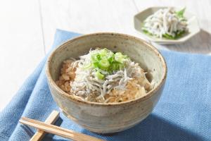 a bowl of food on a blue table at Hiroshima Tokyu REI Hotel in Hiroshima