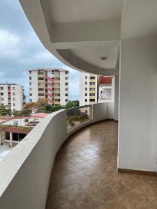 a balcony of a building with a view of buildings at Playa Almendro Resort in Tonsupa +37 photos