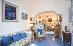 a living room with a couch and chairs and a table at Villa Marina in Anacapri
