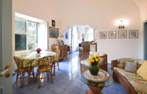 a living room with a table and chairs at Villa Marina in Anacapri