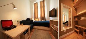ein Wohnzimmer mit Sofa und TV in einem Zimmer in der Unterkunft We Love F Tourists in Lissabon