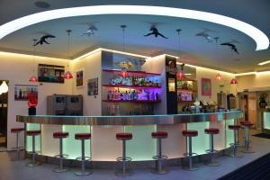 a bar in a restaurant with bats on the ceiling at Arthotel Munich in Munich