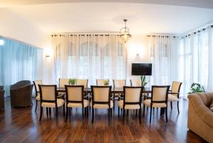 a dining room with a table and chairs at HillCrest Hotel in Kandy