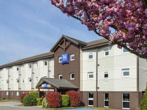 a rendering of a hotel with a building at Ibis budget Rouen Petit Quevilly in Le Petit-Quevilly