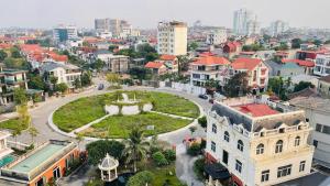 an aerial view of a city with buildings at Glory Hotel Vĩnh Yên in Nhân Mỹ