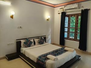 a bedroom with a large bed in a room at Jackfruit in Arambol +58 photos