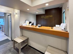 a lobby with a counter with a hotelifted room at Hotel Trend Omiya in Saitama