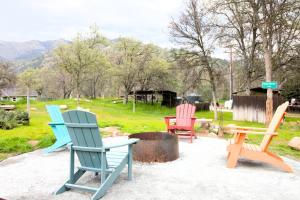 a group of chairs sitting on a patio at The Cabin at Deer Hollow in Three Rivers