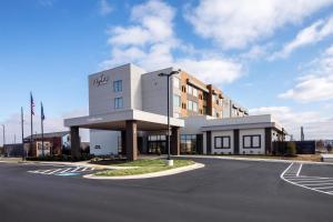 an empty parking lot in front of a building at Tempo By Hilton Manassas in Manassas