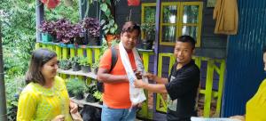 a group of people standing in front of a house at DSD Bomzon Homestay in Darjeeling +9 photos