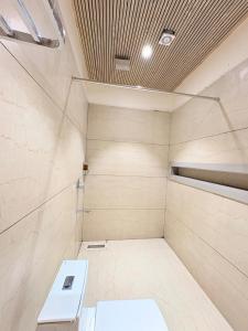 a shower stall with a toilet in a room at Hotel Moti Mahal in Ambikāpur +14 photos