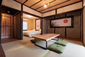 a room with a table and a bed in it at 穂庵-Hoan- in Tanabe
