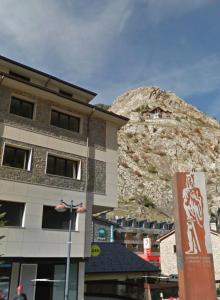 a building with a mountain in the background at Canillo L'Areny View HUT - 7775 in Canillo