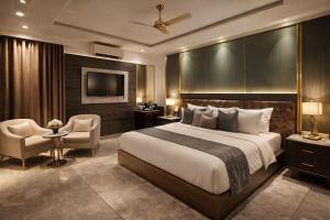 a hotel room with a bed and a chair and a television at Airport NH Skye Suites Hotel Terminal 3, Delhi International Airport With - Free Airport Pickup in New Delhi