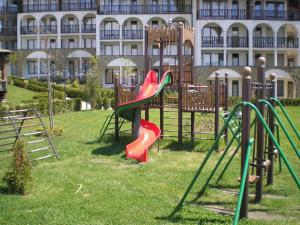 a playground in front of a large building at Stylish, 1-Bedroom at Watermill Complex in Bŭnzareto