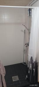 a shower in a bathroom with a shower curtain at Veteli in Veteli +9 photos