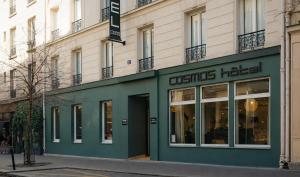 a store front of a building on a street at Hotel Cosmos in Paris