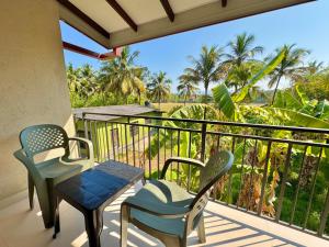 a balcony with two chairs and a table at The Dimora Residence in Kurunegala