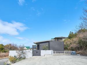 a house on a hill with a driveway at HUG me Ocean awaji in Sumoto