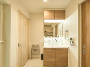 a bathroom with a sink and a toilet at HUG me Ocean awaji in Sumoto +25 photos