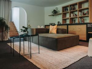 a living room with a couch and a table at Hotel Schönberg in Rio Bianco
