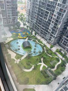 a view of a park from the window of a building at Homestay Ocean Park Building P3 in Gia Lâm Pho