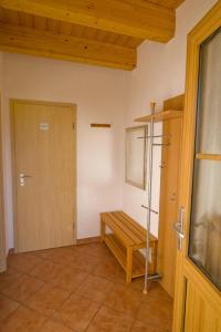 a room with a wooden bench and a door at Wohlfühlbauernhof in Geslau +18 photos