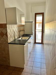a kitchen with a sink and a counter top at Corso Messina in Crotone