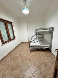 a empty room with a bed in the corner of a room at Corso Messina in Crotone