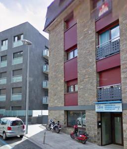 a building with motorcycles parked in front of it at Euro Àtic HUT 6794 in Encamp