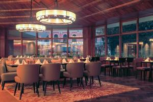 an rendering of a restaurant with tables and chairs at Hotel Yak & Yeti in Kathmandu +75 photos