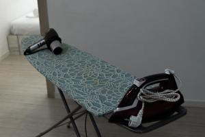 a table with a hair dryer on top of it at Bright 2BR Residence Central Yerevan in Yerevan