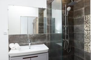 a bathroom with a sink and a shower at Bright 2BR Residence Central Yerevan in Yerevan