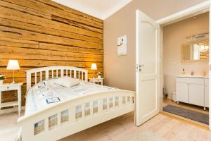 Ένα ή περισσότερα κρεβάτια σε δωμάτιο στο Lossiplatsi Apartment