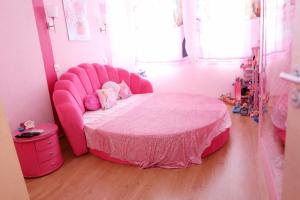 a pink bed in a room with a pink bed frame at Barbie-Themed 3BDR Penthouse Near The Beach, Nessebar in Nesebar
