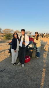 a group of people standing in front of a truck at Chandras palace hotel kothar in Kothār +2 photos